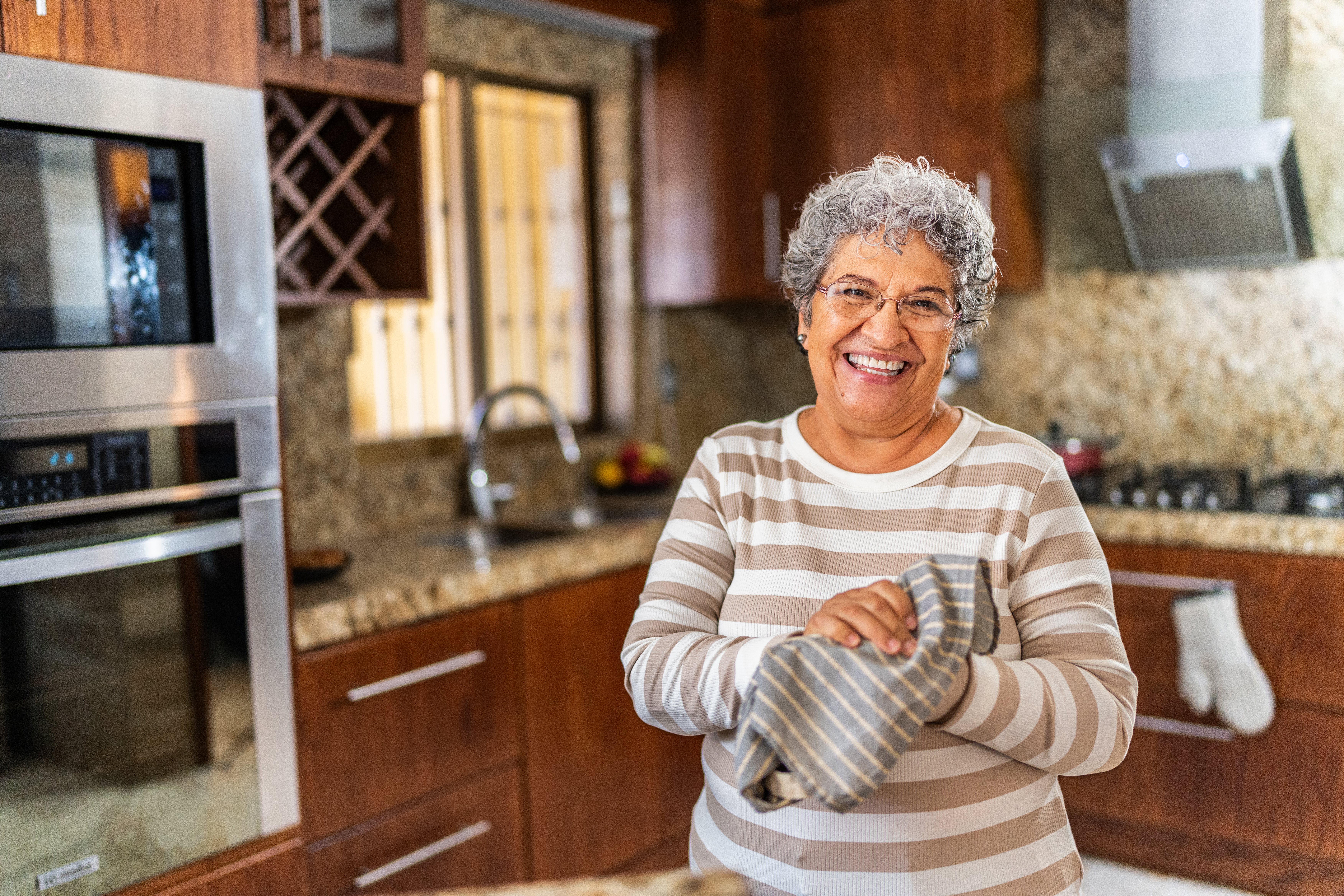 Happy woman in kitchen